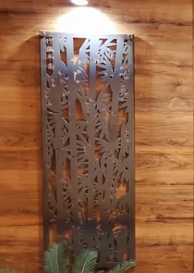Bamboo screen against a wood paneled wall