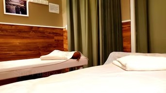 Private treatment room with massage table